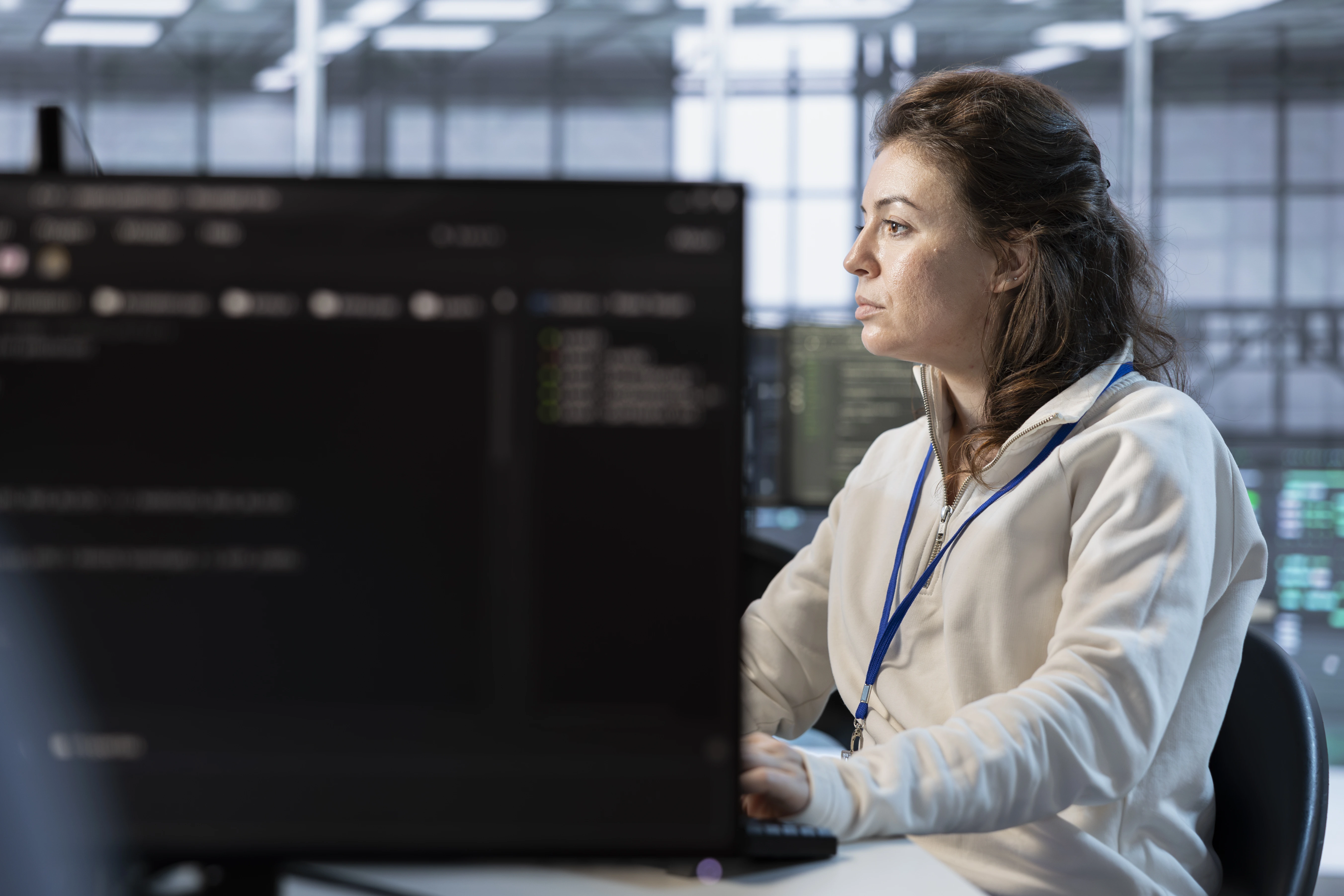 /media/woman-using-pc-integrating-new-technologies-systems-data-center.webp